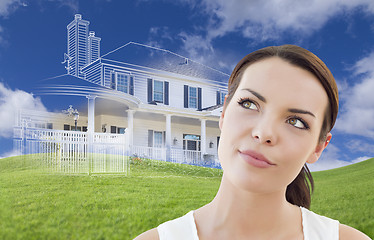 Image showing Mixed Race Female Looks Over to Ghosted House Drawing Behind