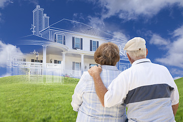 Image showing Senior Couple Faces Ghosted House Drawing, Green Grass Hill Behi