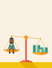 Image showing Afircan Businessman on a balance scale
