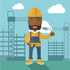 Image showing Black man standing infront of construction crane tower.