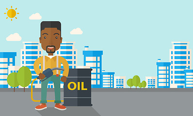 Image showing African Businessman with oil can and pump.