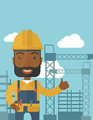 Image showing Black man standing infront of construction crane tower.