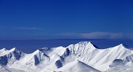 Image showing Snowy mountains at sunny day. Panoramic view