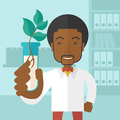 Image showing Black guy Chemist with tube and eco leaves.