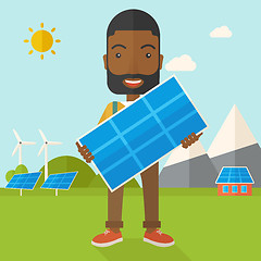 Image showing African man holding a solar panel.