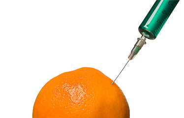 Image showing Glass syringe and orange