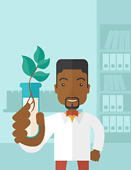 Image showing Black guy Chemist with tube and eco leaves.