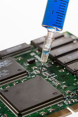 Image showing Glass syringe and circuit board