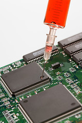 Image showing Glass syringe and circuit board