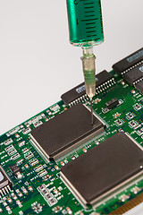 Image showing Glass syringe and circuit board