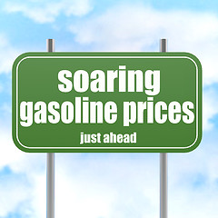 Image showing Green road sign with soaring gasoline prices word