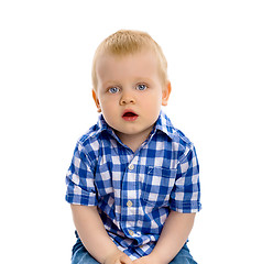 Image showing blue-eyed boy in a plaid shirt