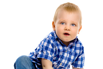 Image showing blue-eyed boy in a plaid shirt