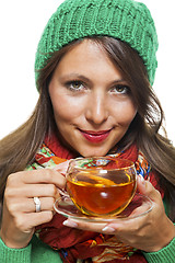 Image showing Attractive woman warming up with a cup of hot tea