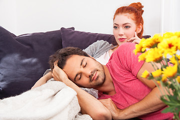 Image showing Young Couple Relaxing on Couch In the Living Room