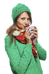 Image showing Pretty Woman in Winter Fashion Drinking Coffee