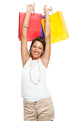 Image showing Happy Woman Raising Colored Shopping Bag