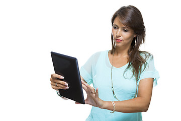 Image showing Pretty Woman Browsing at her Tablet Computer