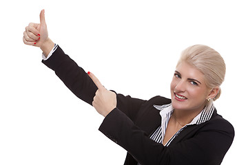 Image showing Businesswoman Pointing Up While Looking at Camera