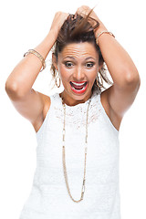 Image showing Happy Woman in Trendy Outfit Holding her Hair Up