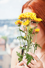 Image showing Thoughtful Woman with Flowers Leaning on Window