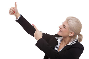 Image showing Businesswoman Pointing Up While Looking at Camera