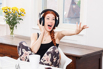 Image showing Happy Young Woman Listening Music In her Room