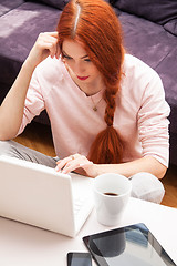 Image showing Young Woman Using Laptop In the Living Room