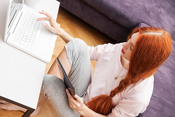 Image showing Young Woman Using Laptop In the Living Room