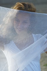 Image showing Young pretty woman with white scarf