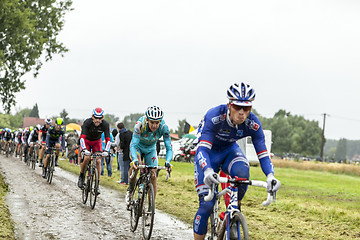 Image showing The Peloton on a Cobbled Road- Tour de France 2014