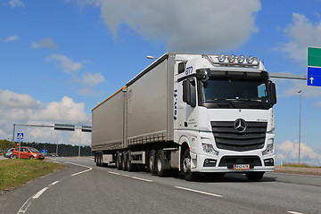 Image showing White Mercedes-Benz Actros Truck Trailer in Traffic