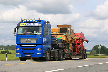 Image showing MAN Truck Hauls Two Combine Harvesters