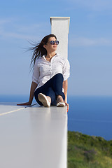 Image showing relaxed woman in front of luxury modern home