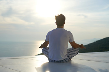 Image showing young man practicing yoga