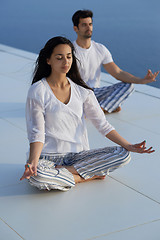 Image showing young couple practicing yoga