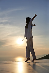 Image showing young woman enjoy sunset