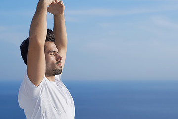 Image showing young man practicing yoga