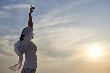 Image showing young woman enjoy sunset