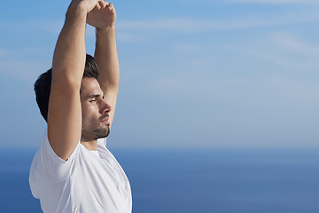 Image showing young man practicing yoga