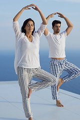 Image showing young couple practicing yoga