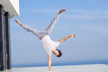 Image showing young man practicing yoga