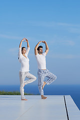 Image showing young couple practicing yoga