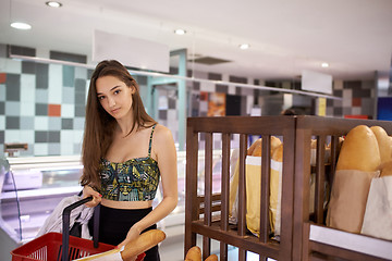 Image showing young woman shopping in supermarket