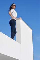 Image showing relaxed woman in front of luxury modern home