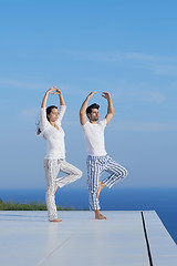 Image showing young couple practicing yoga