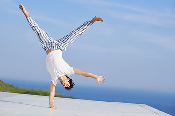 Image showing young man practicing yoga