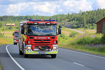 Image showing Two Scania Fire Trucks on the Road at Summer