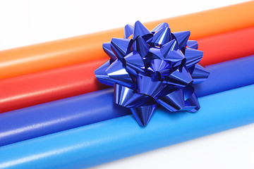 Image showing Colorful wrapping paper and a gift bow