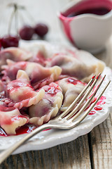 Image showing Plate with cherry dumplings.